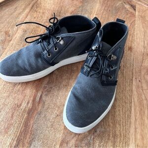 Timberland women’s chukka-style boots in classic black canvas.